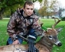 junior hunter with deer